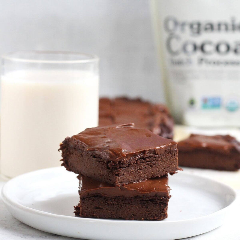 NuNaturals Organic Cocoa Powder with frosted avocado paleo brownies