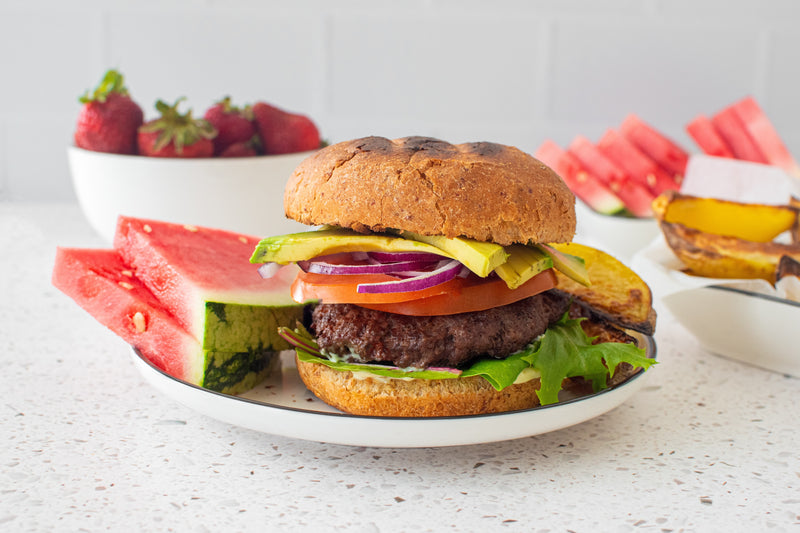 Grilled Burger with watermelon on the side
