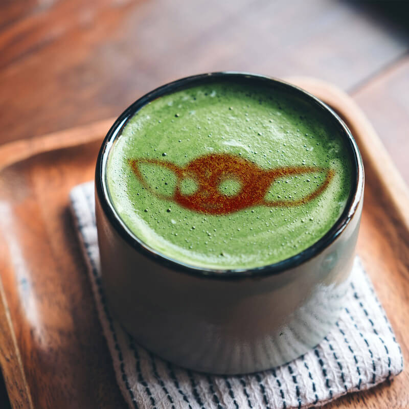 baby yoda salted caramel matcha latte in a mug