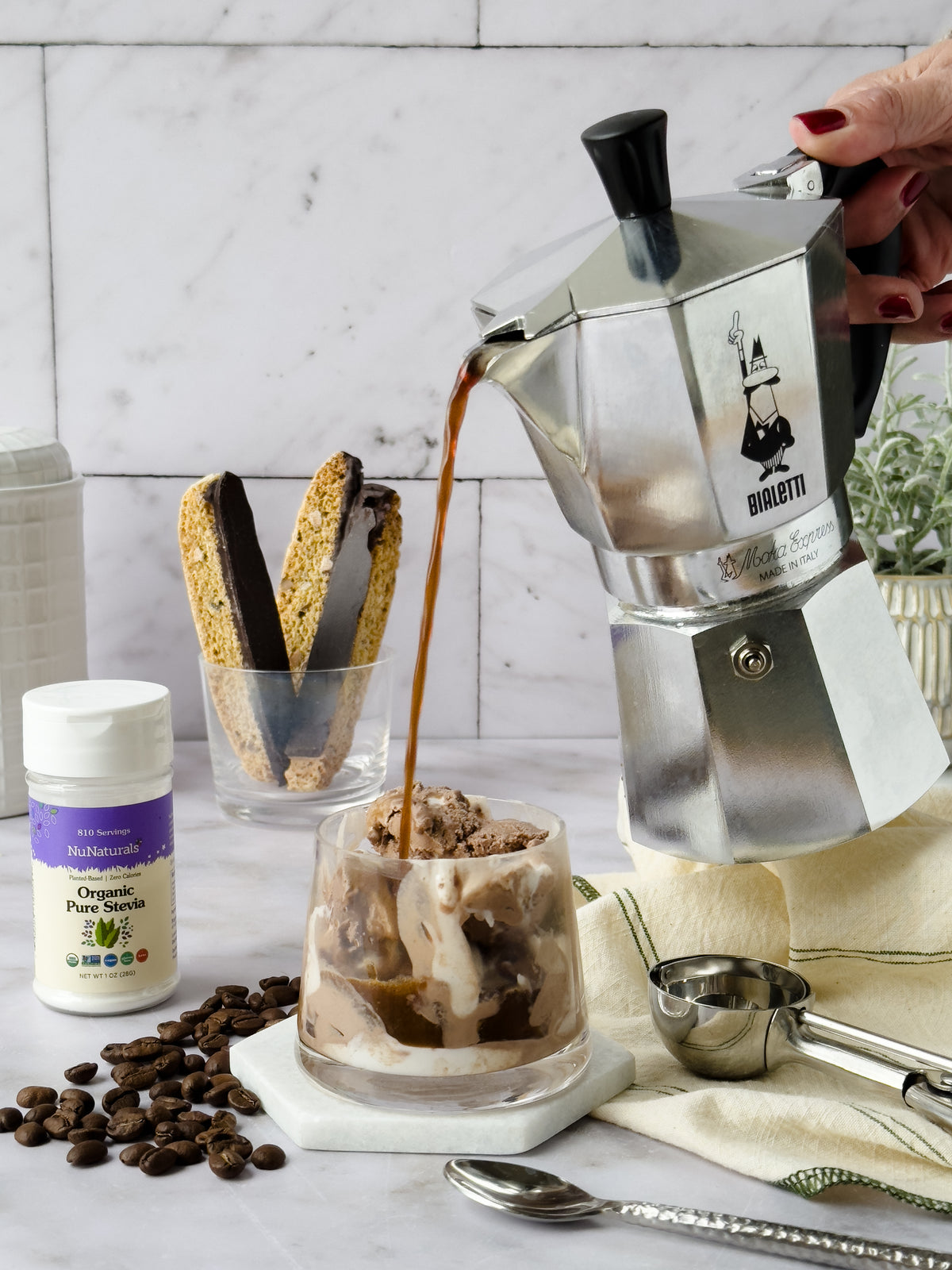 Organic Pure Stevia shaker beside an espresso pot pouring coffee over ice cream, with biscotti and coffee beans