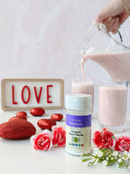Organic Pure Stevia shaker bottle in front of pink smoothies, with a LOVE sign, red hearts and pink carnations