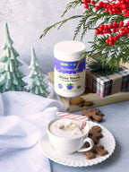 White Stevia Powder canister with holiday trees, a wrapped gift, gingerbread cookies and a cup of hot drink