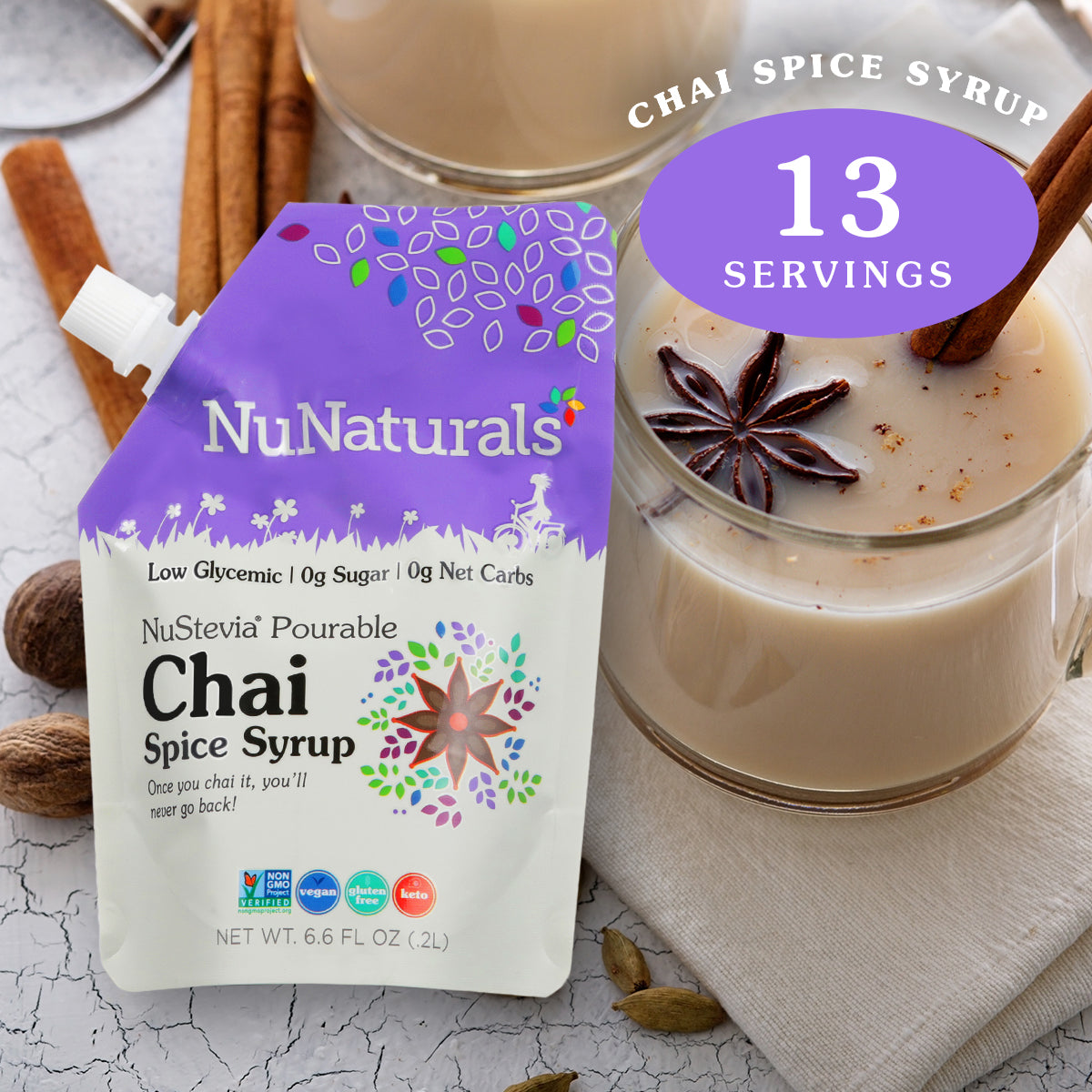 6.6 oz. NuNaturals Chai Spice Pourable Stevia Syrup with glass mug of chai with spices and cinnamon